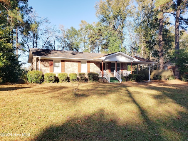 view of front of home featuring a porch and a front lawn