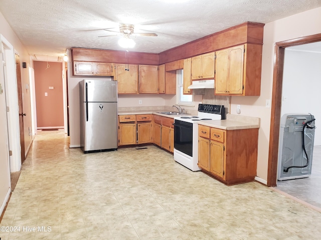 kitchen with stainless steel fridge, sink, a textured ceiling, and white electric stove