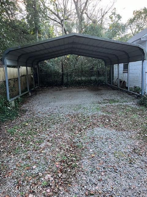 view of vehicle parking featuring a carport