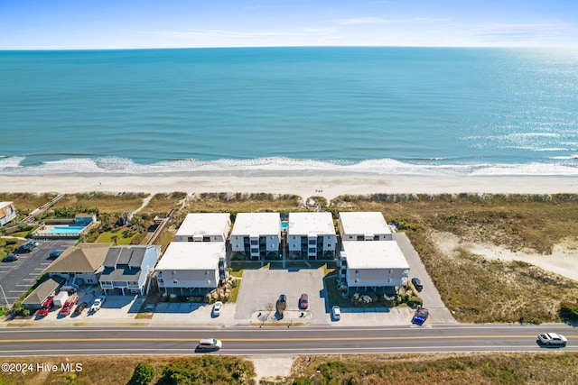 aerial view featuring a water view and a beach view