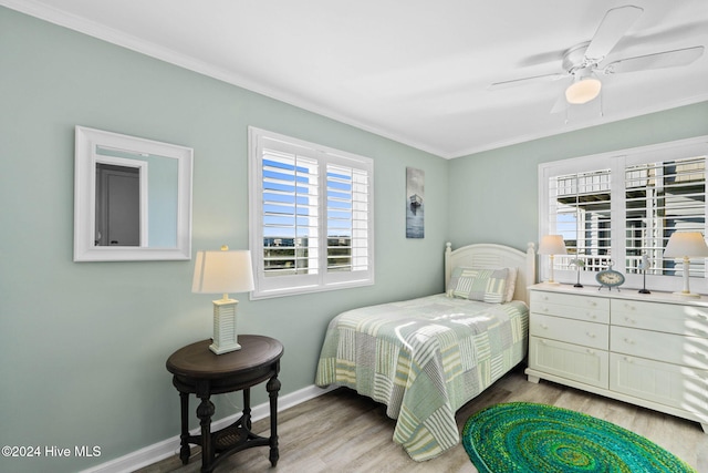 bedroom with ceiling fan and light hardwood / wood-style floors