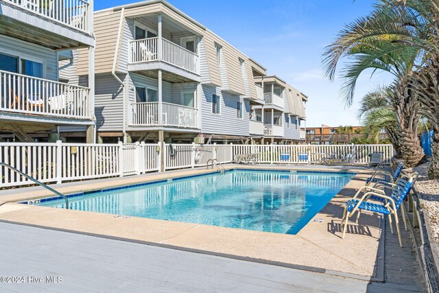 view of swimming pool featuring cooling unit