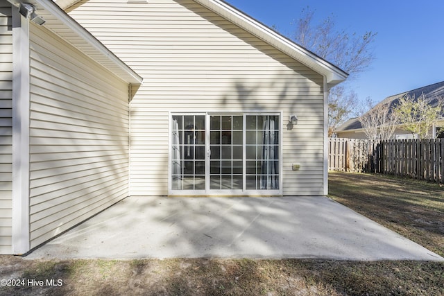 back of property with a patio