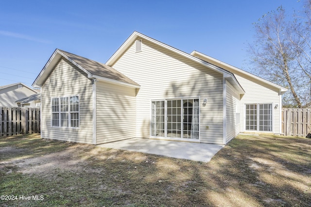 back of property featuring a patio area