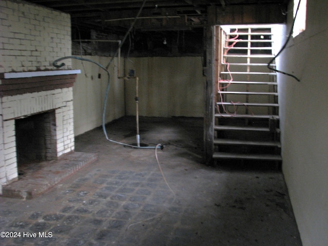 basement with a brick fireplace