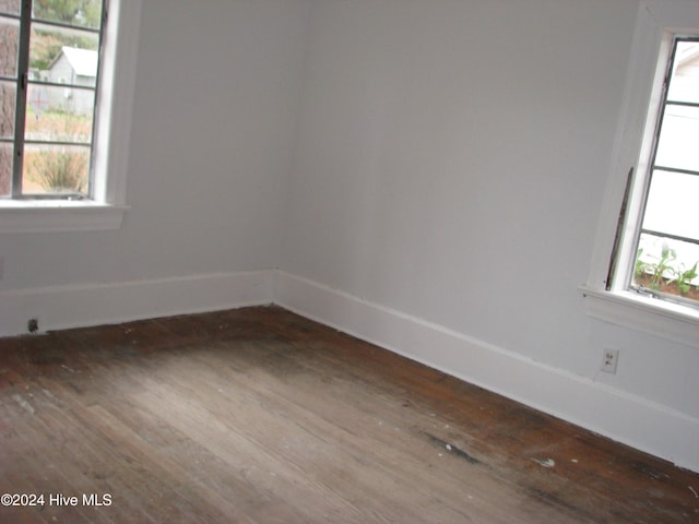 spare room with hardwood / wood-style flooring