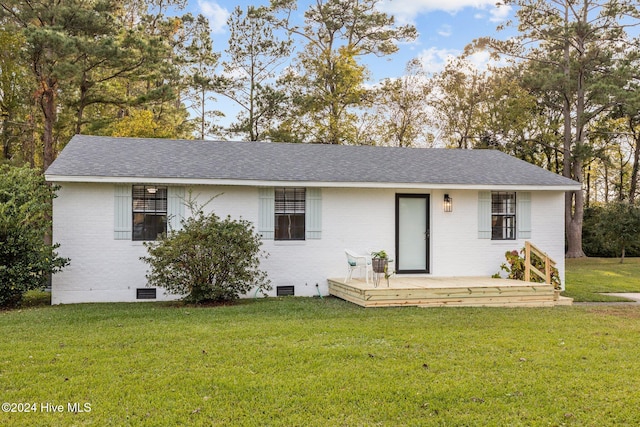 ranch-style house with a front lawn