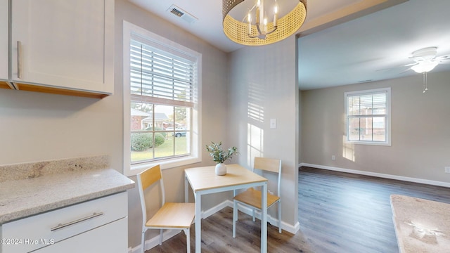 dining area with hardwood / wood-style flooring, plenty of natural light, and ceiling fan