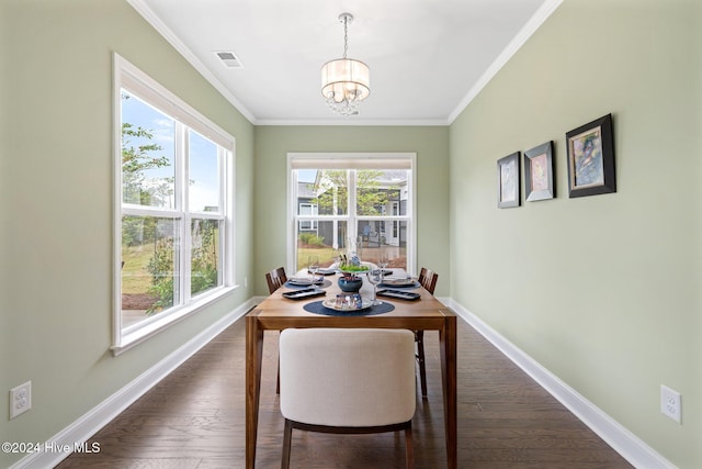 dining space with a chandelier, crown molding, baseboards, and dark wood-style flooring