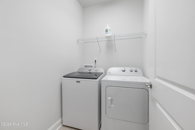 laundry area with washing machine and dryer