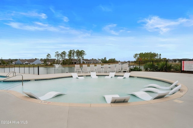 community pool featuring fence