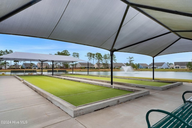 view of community featuring a bocce ball area, a water view, and a residential view