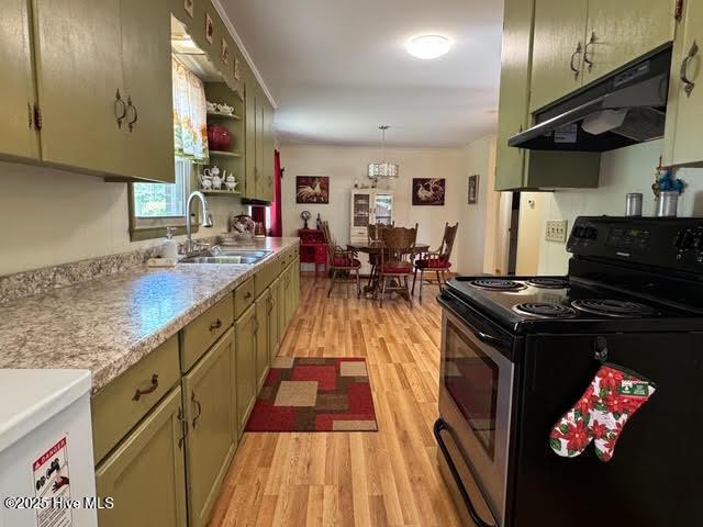 kitchen featuring a sink, stainless steel electric stove, under cabinet range hood, light wood-style flooring, and light countertops