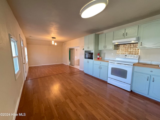 kitchen with backsplash, wood-type flooring, white electric range, white cabinetry, and black microwave