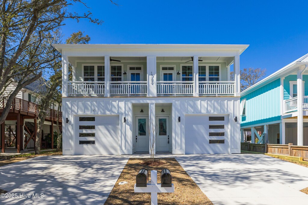 view of front of house with a garage and a balcony