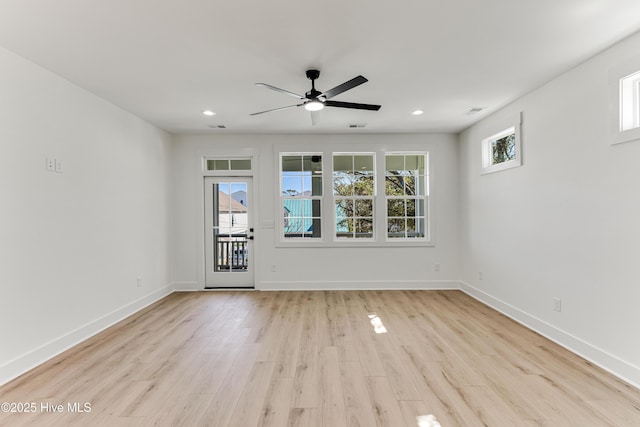 empty room with light wood finished floors, visible vents, baseboards, ceiling fan, and recessed lighting