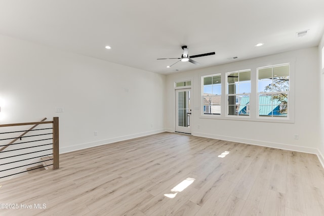 unfurnished room featuring visible vents, recessed lighting, light wood-style flooring, and baseboards