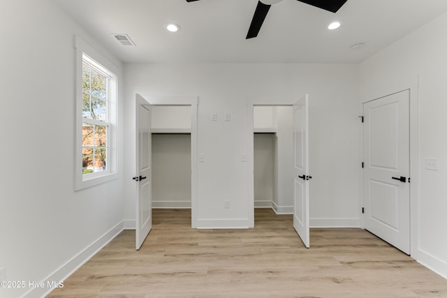 unfurnished bedroom featuring light wood-style flooring, visible vents, and recessed lighting