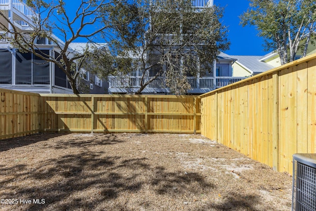 view of yard featuring a fenced backyard and central AC unit