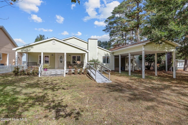 view of front of property with covered porch and a front yard