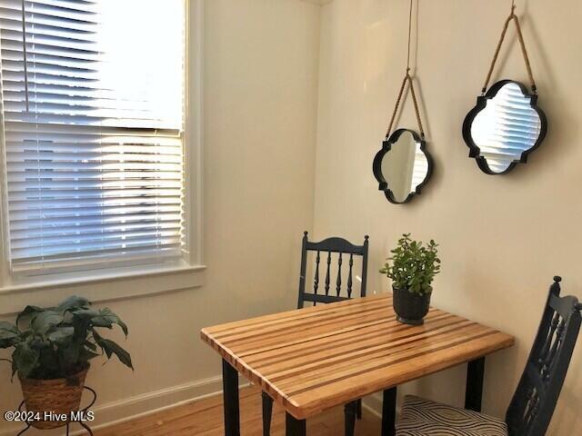 dining area with wood-type flooring