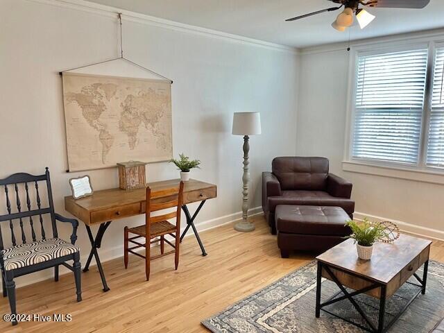 sitting room featuring crown molding, ceiling fan, and wood-type flooring