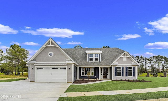 craftsman inspired home featuring a porch, a garage, and a front lawn