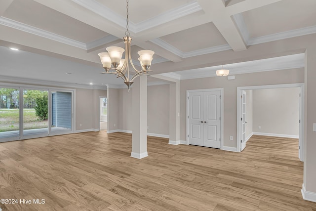 empty room with beam ceiling, light hardwood / wood-style flooring, coffered ceiling, and crown molding