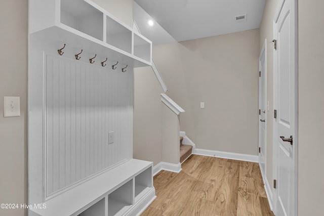 mudroom with light hardwood / wood-style flooring