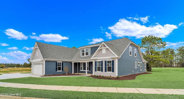 view of front facade featuring a garage and a front lawn