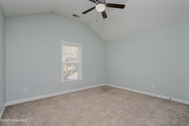 unfurnished room featuring vaulted ceiling, ceiling fan, and carpet