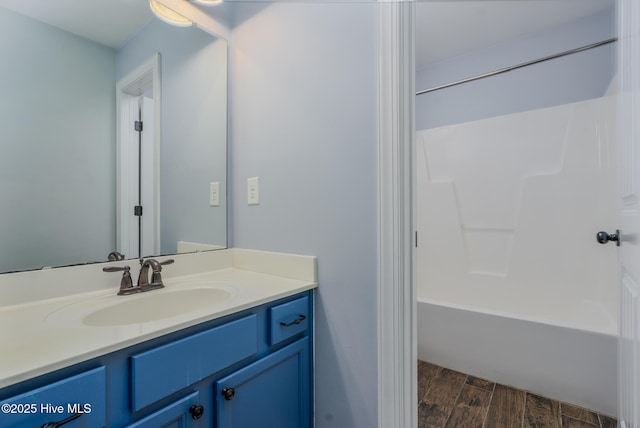 bathroom with vanity and shower / washtub combination