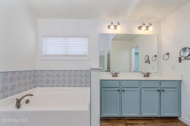 bathroom with a bath and vanity