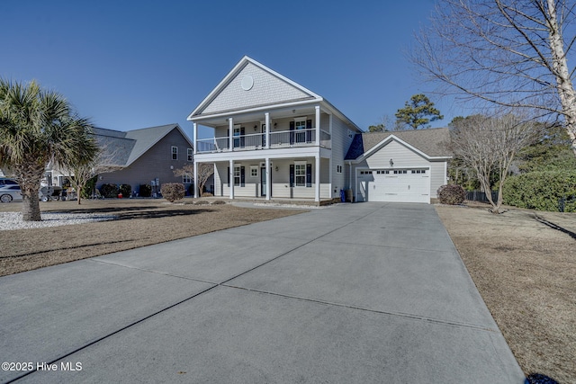 view of front of property with a garage, a porch, and a balcony