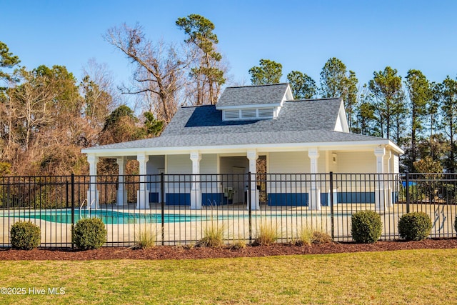 exterior space featuring a patio area, a fenced in pool, and a front yard