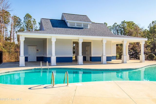 view of swimming pool with a patio