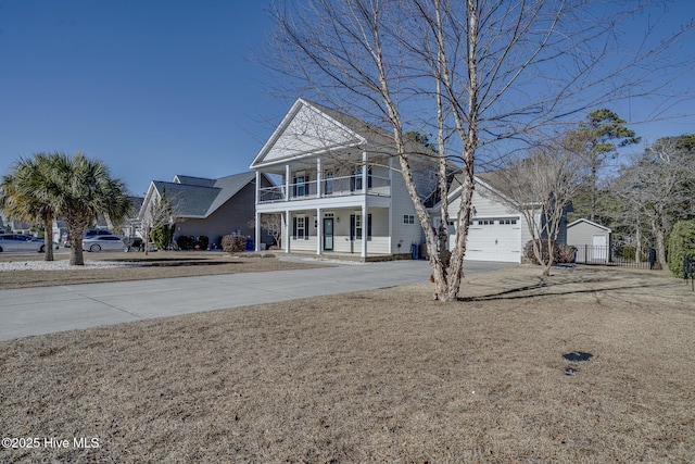 view of front property with a shed, a balcony, and covered porch