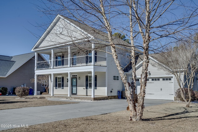 view of front property featuring cooling unit, a balcony, a porch, and a garage