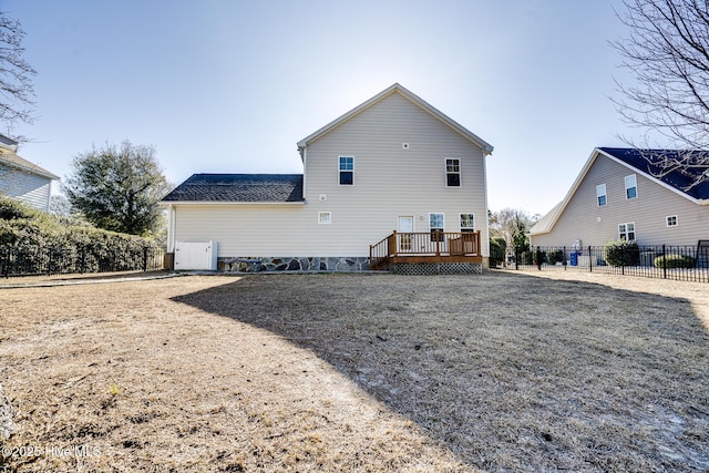 back of property with a wooden deck