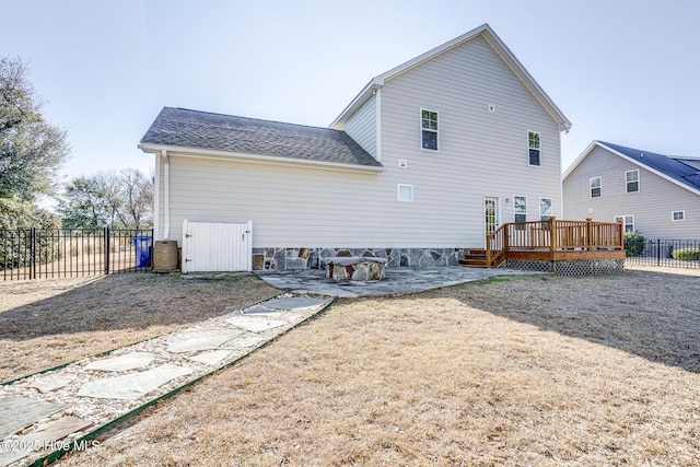 rear view of house with a deck