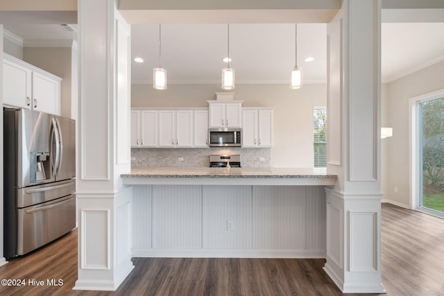 kitchen featuring plenty of natural light, white cabinets, and appliances with stainless steel finishes