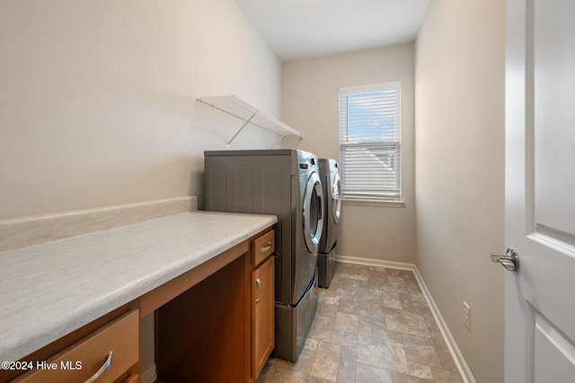 washroom with washer and dryer