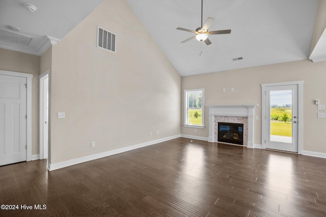 unfurnished living room featuring a high end fireplace, ceiling fan, dark hardwood / wood-style flooring, and high vaulted ceiling