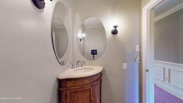 bathroom featuring vanity and crown molding