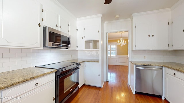 kitchen featuring white cabinetry, light hardwood / wood-style flooring, and stainless steel appliances