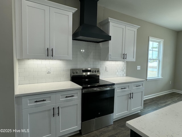 kitchen featuring white cabinetry, wall chimney exhaust hood, dark wood finished floors, and electric stove