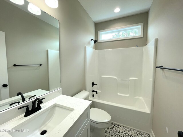 clothes washing area featuring washer hookup, cabinets, and light tile patterned flooring