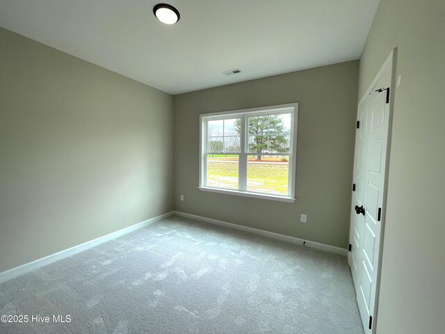 spare room with a raised ceiling, crown molding, dark hardwood / wood-style floors, and ceiling fan