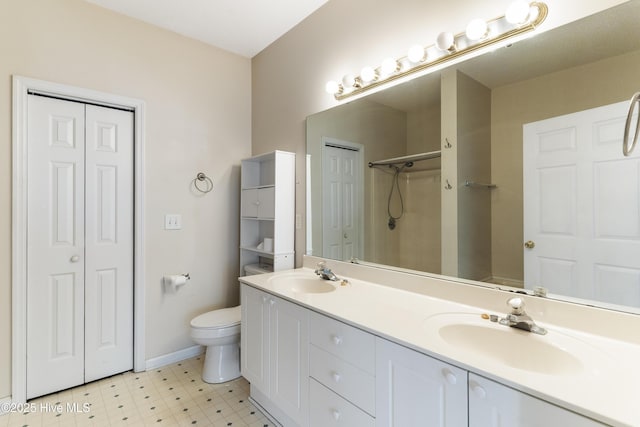 bathroom with vanity, toilet, and walk in shower