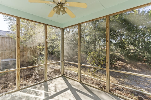 unfurnished sunroom with ceiling fan